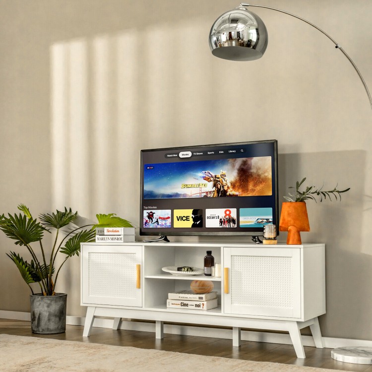Mid-century modern TV stand in white featuring rattan doors, open shelving, and a large surface for stylish TV display.